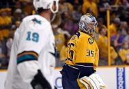 Nashville Predators goalie Pekka Rinne (35) exchanges words with San Jose Sharks center Joe Thornton (19) during a stop in play during the overtime period in game four of the second round of the 2016 Stanley Cup Playoffs at Bridgestone Arena. Mandatory Credit: Aaron Doster-USA TODAY Sports