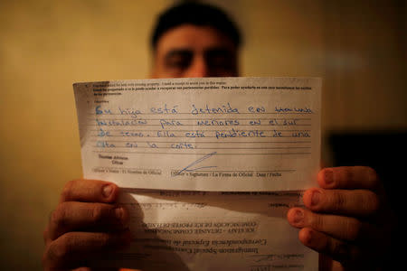 Melvin Garcia, 37, a deportee from the U.S. who was separated from his daughter Daylin Garcia, 12, at the McAllen entry point under the Trump administration's hardline immigration policy, shows a letter sent by U.S. Immigration and Customs Enforcement during an interview with Reuters in Choloma, Honduras, June 21, 2018. Letter reads "Your daughter is detained in a juvenile detention center in South Texas. She is pending an appointment in court ". Picture taken on June 21, 2018. REUTERS/Carlos Jasso