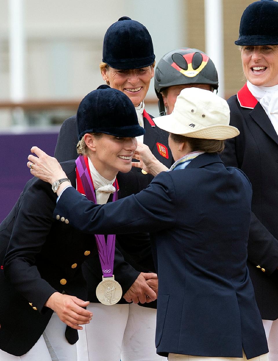 Princess Anne presents her daughter Zara with a silver medal (AFP via Getty Images)