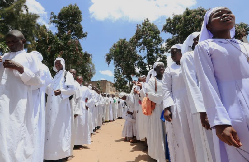 Faithful participate in a holy procession after celebrating a mass, amid concerns about the spread of coronavirus disease (COVID-19) at the St. Joanes, Legio Maria African Mission Church within Fort Jesus in Kibera slums of Nairobi