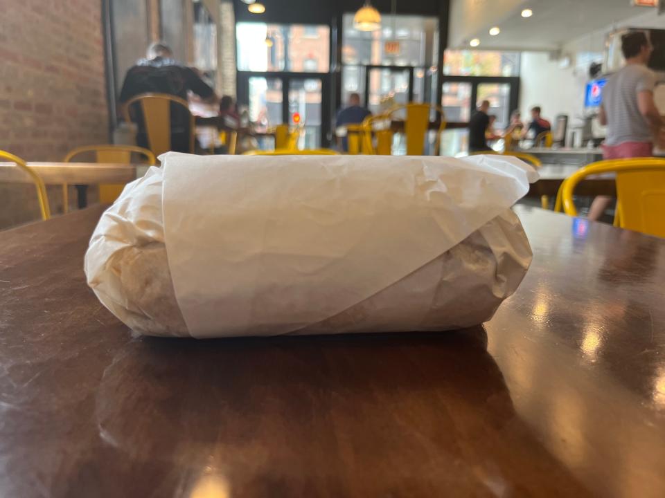 A beef sandwich in a wrapper.