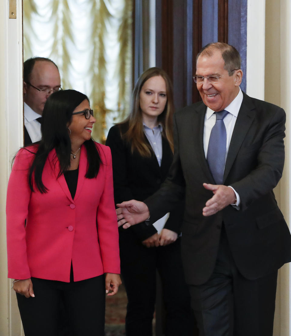 Russian Foreign Minister Sergey Lavrov, right, welcomes Venezuela's Vice President Delcy Rodriguez for talks in Moscow, Russia, Friday, March 1, 2019. (AP Photo/Pavel Golovkin)