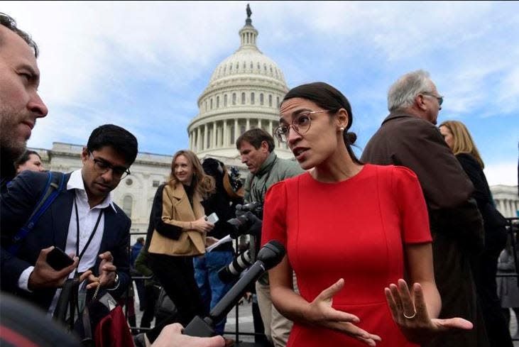 Rep.-elect Alexandria Ocasio-Cortez, D-N.Y., talks with reporters Nov. 14, 2018, following a photo opportunity on Capitol Hill in Washington, with the freshman class. Ocasio-Cortez seems to be everywhere. She’s cooked soup, live on Instagram. She’s done laundry in public. And she’s clapped back at critics of her clothing and a misstatement. The New York Democrat, who at 29 is the youngest woman to be elected to Congress, says she’s documenting her journey to Capitol Hill to lift some of the mystery of the place and make it, ‘real.’