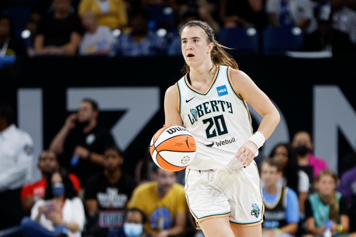 New York Liberty guard Sabrina Ionescu (20) brings the ball up court against the Chicago Sky during the second half of game one of the first round of the WNBA playoffs at Wintrust Arena Aug. 17, 2022, in Chicago.