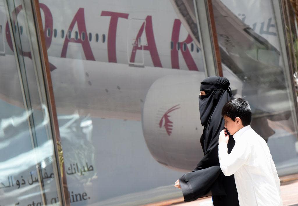 A Qatari passenger is going to be no less terrified that the pilot might lose his bearings just because the Qatar Airways logo has been removed in the second half of a video sequence: AFP/Getty