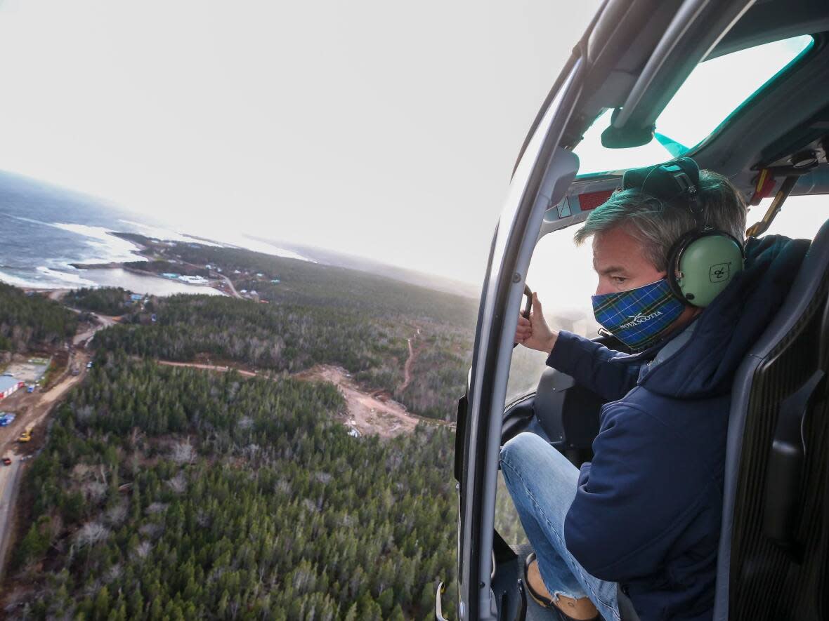 Premier Tim Houston surveyed storm damage in Victoria County on Saturday. (Communications Nova Scotia - image credit)