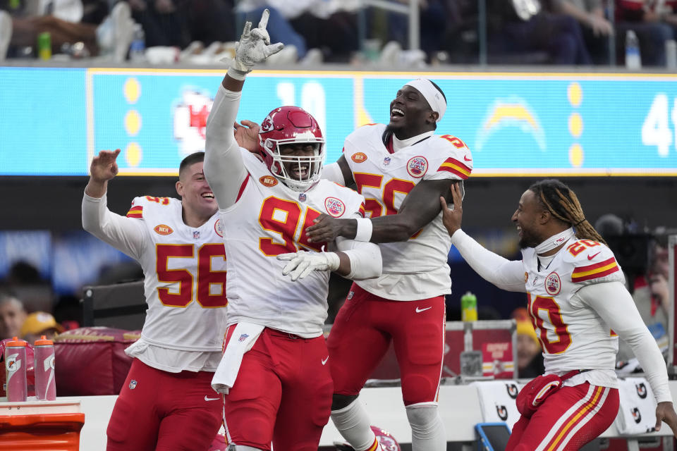 Kansas City Chiefs defensive tackle Chris Jones, second from left, celebrates with teammates after sacking Los Angeles Chargers quarterback Easton Stick during the second half of an NFL football game, Sunday, Jan. 7, 2024, in Inglewood, Calif. The sack earned Jones a $1.25 million contract incentive. (AP Photo/Ashley Landis)