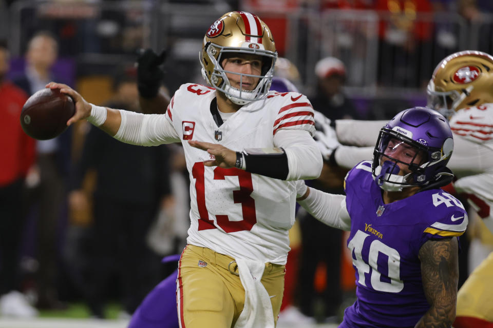 San Francisco 49ers quarterback Brock Purdy (13) is pressured by Minnesota Vikings linebacker Ivan Pace Jr. (40) during the second half of an NFL football game, Monday, Oct. 23, 2023, in Minneapolis. (AP Photo/Bruce Kluckhohn)