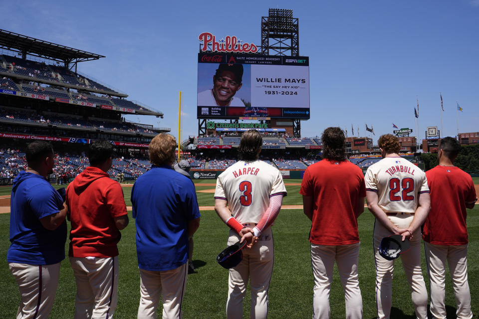 A moment of silence in memory of Willie Mays is observed before a baseball game between the Philadelphia Phillies and the San Diego Padres, Wednesday, June 19, 2024, in Philadelphia. (AP Photo/Matt Slocum)
