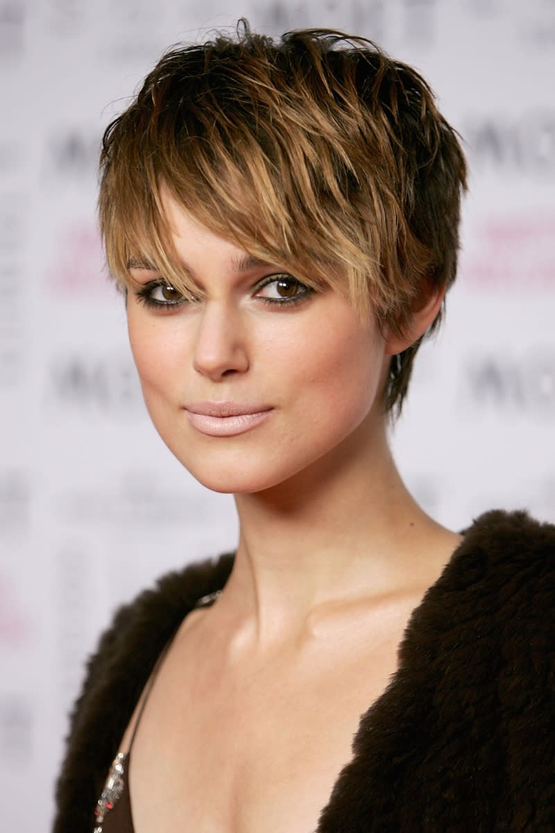 Keira Knightley is pictured with a pixie cut and bangs as she  arrives at the Moet & Chandon Fashion Tribute award at the biennial awards ceremony recognising excellence in the fashion industry, during London Fashion Week Autumn/Winter 2005/6 at Old Billingsgate Market on February 16, 2005 in London. The award goes to a UK designer who has influenced the fashion world on an international level.