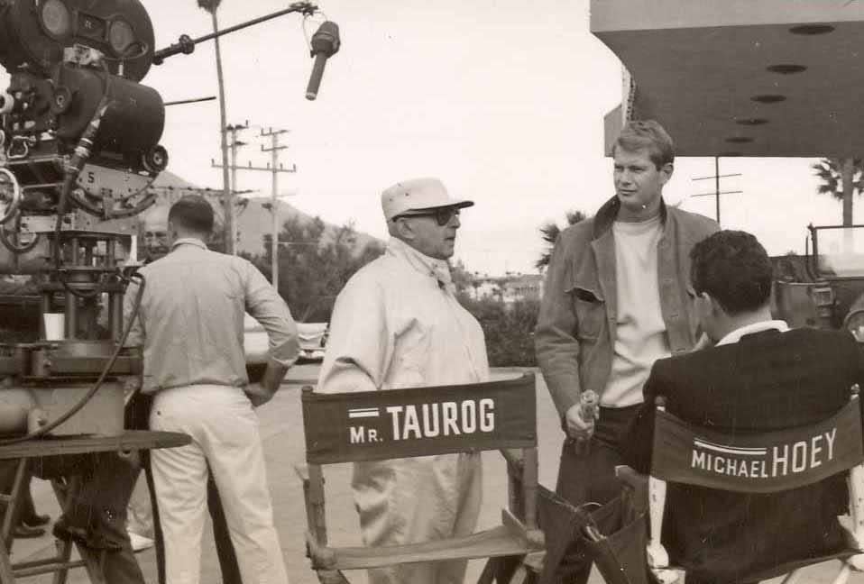 Director Norman Taurog and producer Michael Hoey speak with Troy Donahue during filming of "Palm Springs Weekend" in 1963.