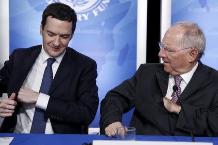 Britain's Chancellor of the Exchequer George Osborne (L) and Germany's Finance Minister Wolfgang Schaeuble depart at the conclusion of a news conference at the IMF/World Bank Spring Meetings in Washington April 14, 2016. REUTERS/Jonathan Ernst