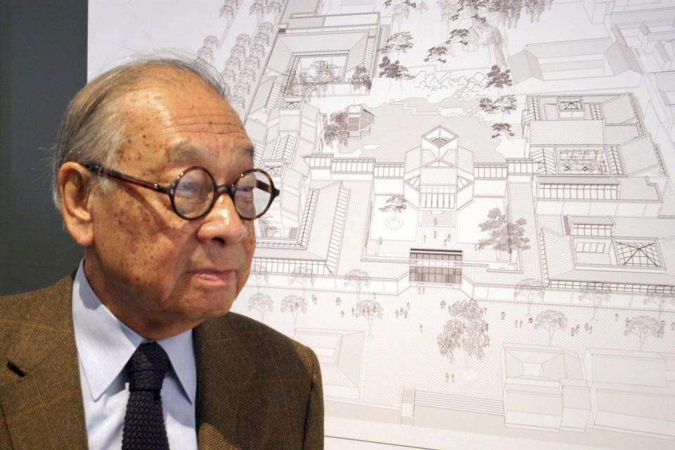 In this Nov. 3, 2003, photo, Chinese-American architect I.M. Pei stands with the plans of the Suzhou Museum in Suzhou in eastern China's Jiangsu Province. Pei, the versatile, globe-trotting architect who revived the Louvre with a giant glass pyramid and captured the spirit of rebellion at the multi-shaped Rock and Roll Hall of Fame, has died at age 102, a spokesman confirmed Thursday, May 16, 2019. (Chinatopix via AP)