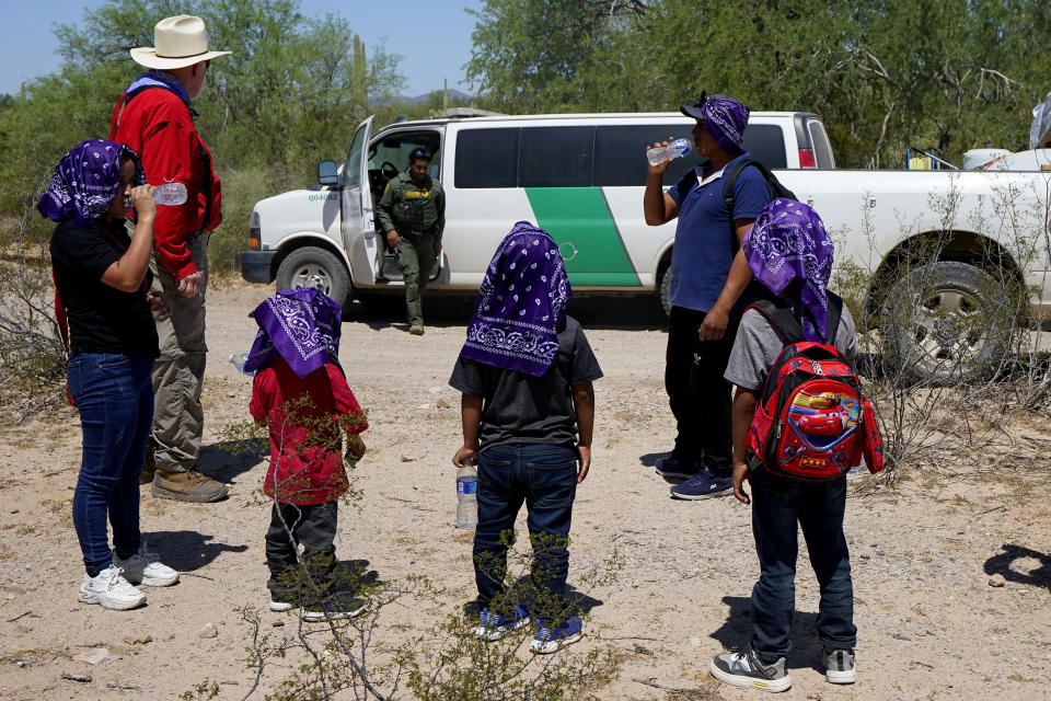 A U.S. Customs and Border Patrol agent arrives to pick up a family of five claiming to be from Guatemala after they crossed the border fence in the Tucson Sector of the U.S.-Mexico border, Tuesday, Aug. 29, 2023, in Organ Pipe Cactus National Monument near Lukeville, Ariz. U.S. Customs and Border Protection reports that the Tucson Sector is the busiest area of the border since 2008 with rescues by air and land along the U.S. border with Mexico soaring this year, with 28,537 counted during the 10-month period ending July 31. That compares with 22,072 tallied during the 12-month period ending Sept. 30, 2022. (AP Photo/Matt York)