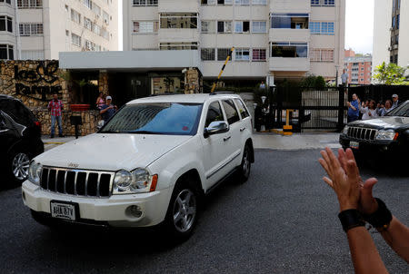 A group of vehicles supposedly carrying Venezuelan opposition leader Juan Guaido, who many nations have recognised as the country's rightful interim ruler, leave his house in Caracas, Venezuela February 21, 2019. REUTERS/Carlos Garcia Rawlins