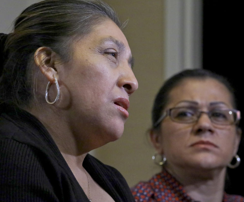 Sandra Diaz, right, listens as Victorina Morales, right, recalls her experience working at President Donald Trump's golf resort in Bedminster, N.J., during an interview, Friday Dec. 7, 2018, in New York. Both Morales and Diaz say they used false legal documents to get hired at the resort and supervisors knew it. (AP Photo/Bebeto Matthews)