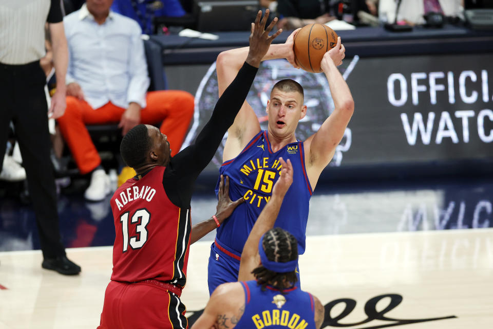 Miami Heat center Bam Adebayo defends Denver Nuggets center Nikola Joki&#x000107; during the first quarter in Game 1 of the 2023 NBA Finals at Ball Arena in Denver on June 1, 2023. (Matthew Stockman/Getty Images)