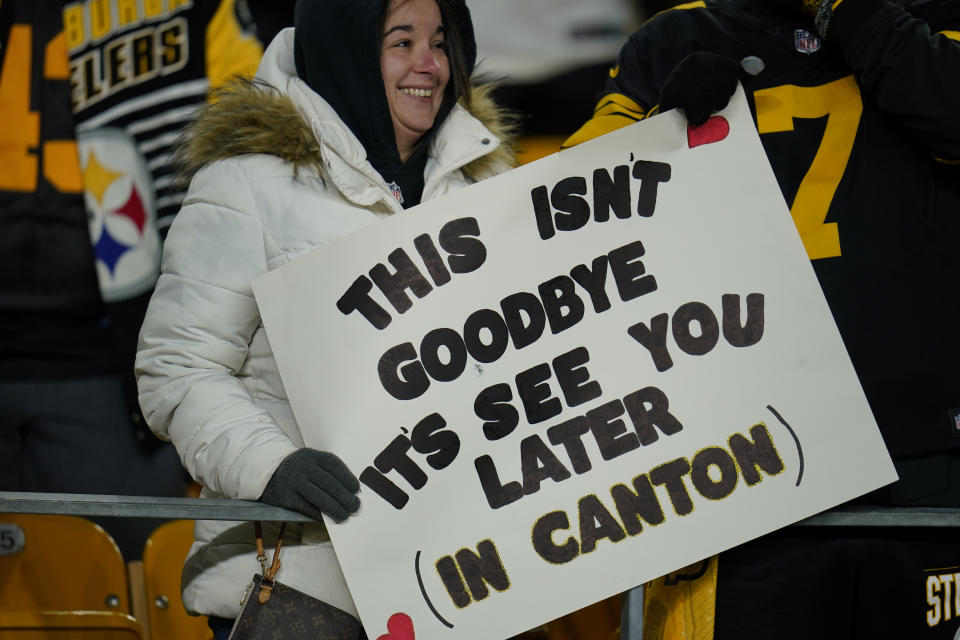 A Pittsburgh Steelers fan holds a sign for quarterback Ben Roethlisberger at Heinz Field as the teams warms up before an NFL football game against the Cleveland Browns, Monday, Jan. 3, 2022, in Pittsburgh. (AP Photo/Gene J. Puskar)
