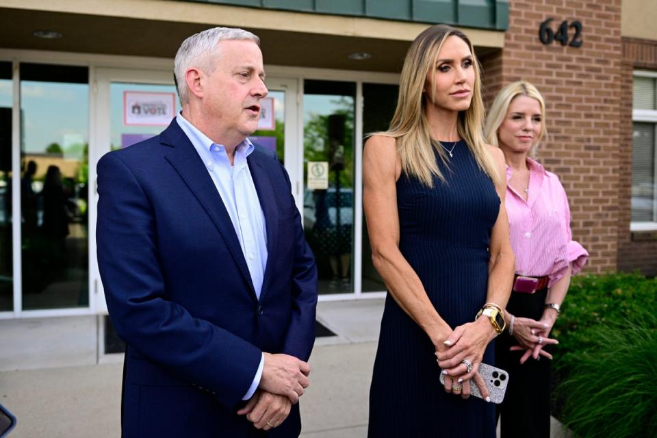 Michael Whatley, left, and Lara Trump, co-chairs of the Republican National Committee, speak to reporters on June 18. The RNC and Donald Trump’s campaign have launched a massive early voting campaign while suing states to block early voting rules (AP)