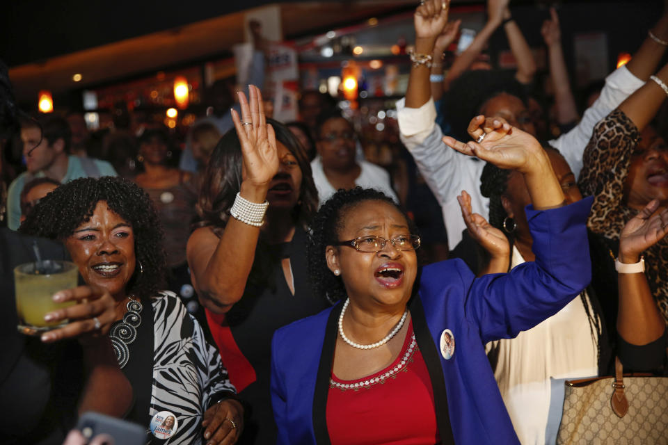 Supporters celebrate after the Democratic primary for attorney general was called in favor of Letitia James Thursday, Sept. 13, 2018, in New York. (AP Photo/Kevin Hagen)