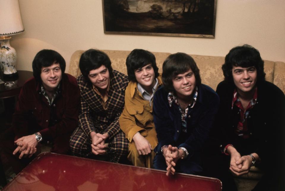 Donny Osmond (middle) pictured with his brothers when group The Osmonds visited London in 1972 (Getty Images)