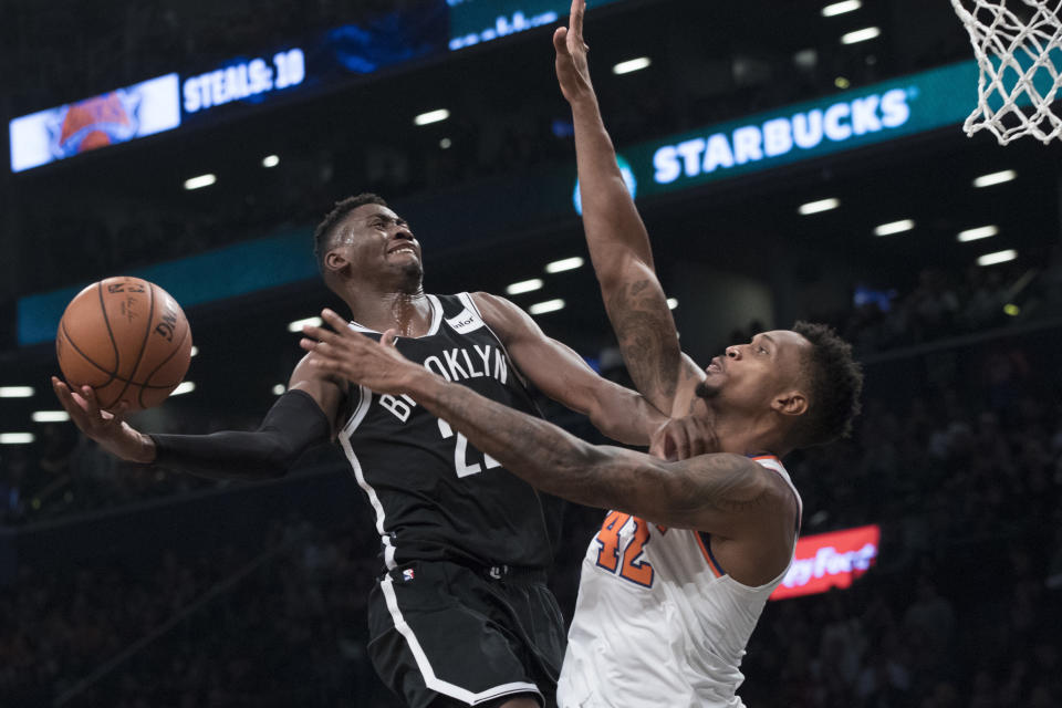 Brooklyn Nets guard Caris LeVert (22) goes to the basket against New York Knicks forward Lance Thomas (42) during the second half of an NBA basketball game, Friday, Oct. 19, 2018, in New York. (AP Photo/Mary Altaffer)