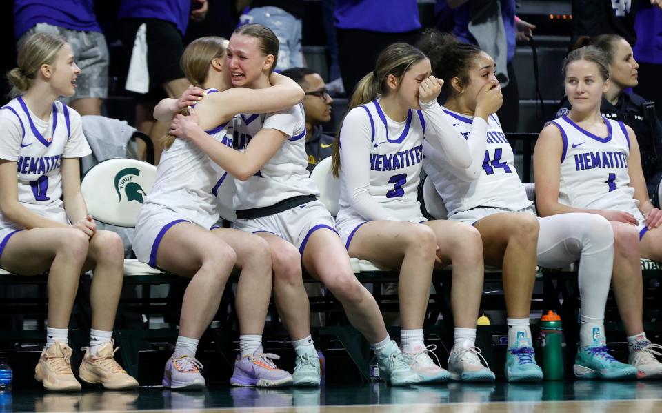 Ishpeming starting players celebrate on the bench after Ishpeming's 73-54 win over Kingston in the Division 4 girls basketball state final at Breslin Center in East Lansing on Saturday, March 23, 2024.
