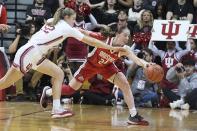 Indiana's Lilly Meister (52) amd Ohio State's Taylor Mikesell (24) vie for the ball during the first half of an NCAA college basketball game Thursday, Jan. 26, 2023, in Bloomington, Ind. (AP Photo/Darron Cummings)