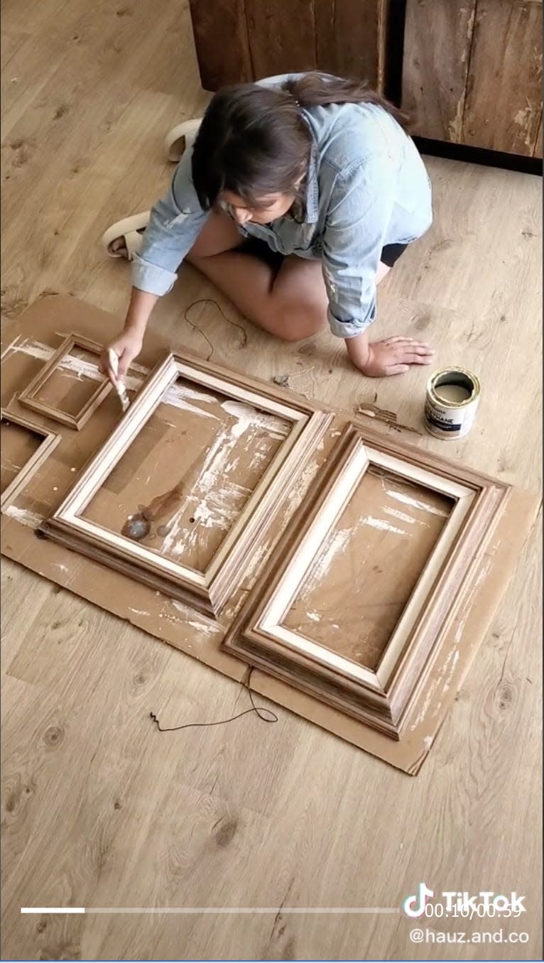 Sarahli Wilcox making picture frame cabinets