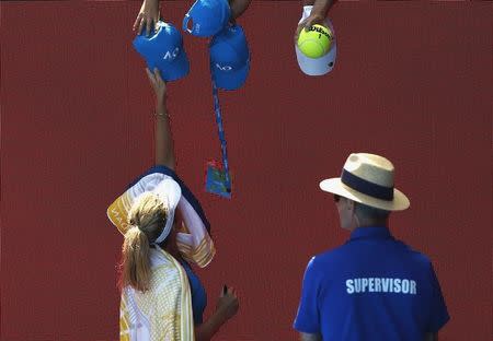 Tennis - Australian Open - Melbourne Park, Melbourne, Australia - 24/1/17 Coco Vandeweghe of the U.S. signs autographs after winning her Women's singles quarter-final match against Spain's Garbine Muguruza. REUTERS/Thomas Peter