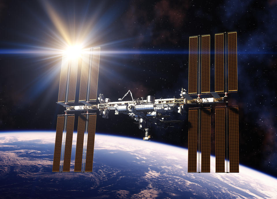 Reflecting Sun In Solar Panels Of International Space Station. 3D Illustration.