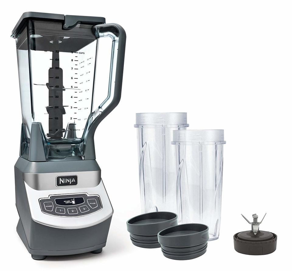 ninja professional countertop blender with two extra cups and lids on a white background