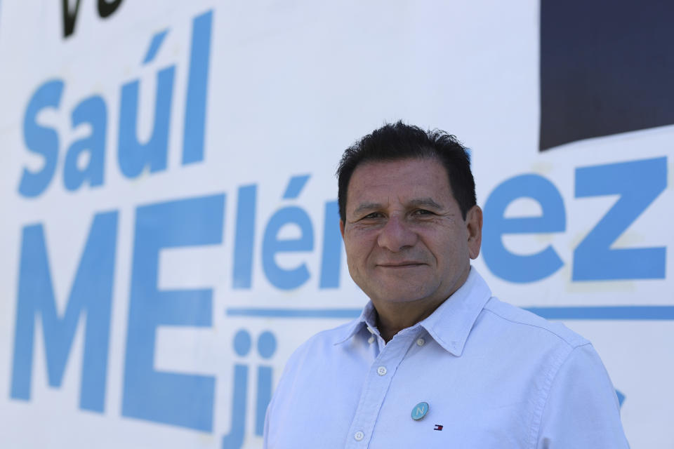 Former guerrilla fighter Saul Melendez poses for a photo outside the New Ideas party's Campaign House in Mejicanos, El Salvador, Sunday, April 4, 2021. Melendez was for years a loyal member of the leftist Farabundo Martí National Liberation Front party, but at the end of February, he won his first elected office as a member of President Nayib Bukele’s New Ideas party. (AP Photo/Salvador Melendez)