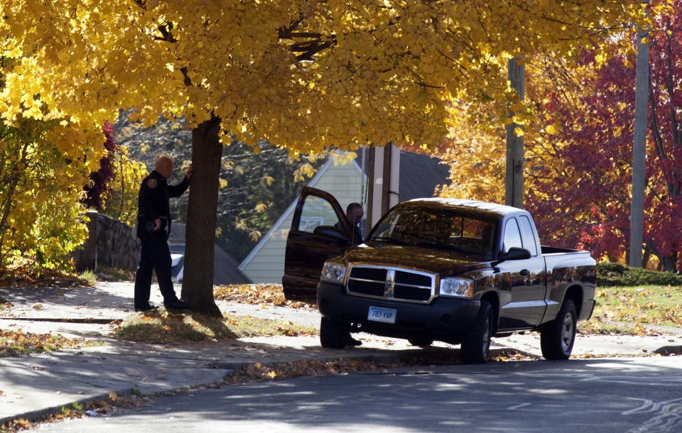 Law enforcement officers guard a side street near Central Connecticut State University while it is in lockdown in New Britain, Connecticut November 4, 2013. A person has been taken into custody at Central Connecticut State University on Monday after officials locked down the campus when a suspicious person, possibly armed, was spotted, said New Britain Mayor Tim O'Brien. Citing students, local media said police had searched for a person who appeared to be carrying a gun and what looked like a sword. (REUTERS/Michelle McLoughlin)