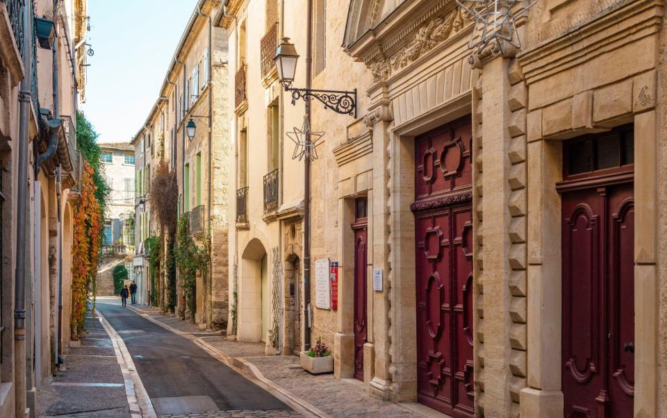 France, Herault, Pezenas, Pezenas theater, downtown street of a southern village and the facade of a theater