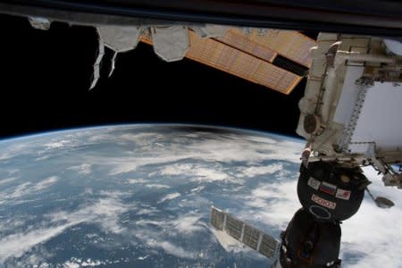 FILE PHOTO: The umbra, the moon's shadow, over the United States from space is seen from the International Space Station from outer space, August 21, 2017 in this social media image.   Courtesy @Space_Station/Intl. Space Station/Handout via REUTERS