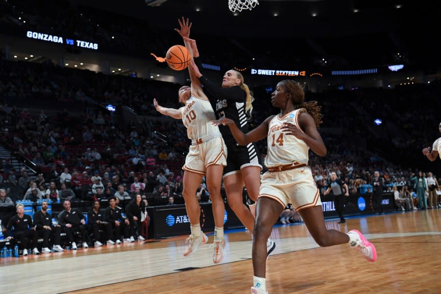Texas guard Shay Holle (10) blocks a shot by Gonzaga forward Eliza Hollingsworth during the second half of a Sweet 16 college basketball game in the women’s NCAA Tournament, Friday, March 29, 2024, in Portland, Ore. (AP Photo/Steve Dykes)