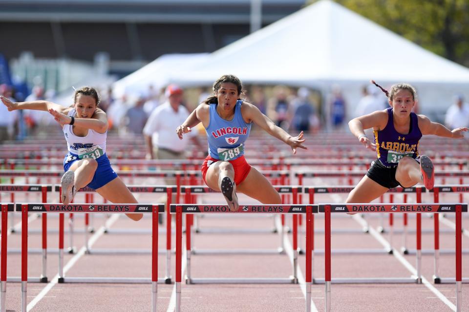 Rapid City Stevens' Baylee Van Zee, Lincoln's Dymond Nave and Watertown's Myah Morris competes in the 100 meter hurdles in the final day of the state track meet on Saturday, May 28, 2022, Howard Wood Field in Sioux Falls.