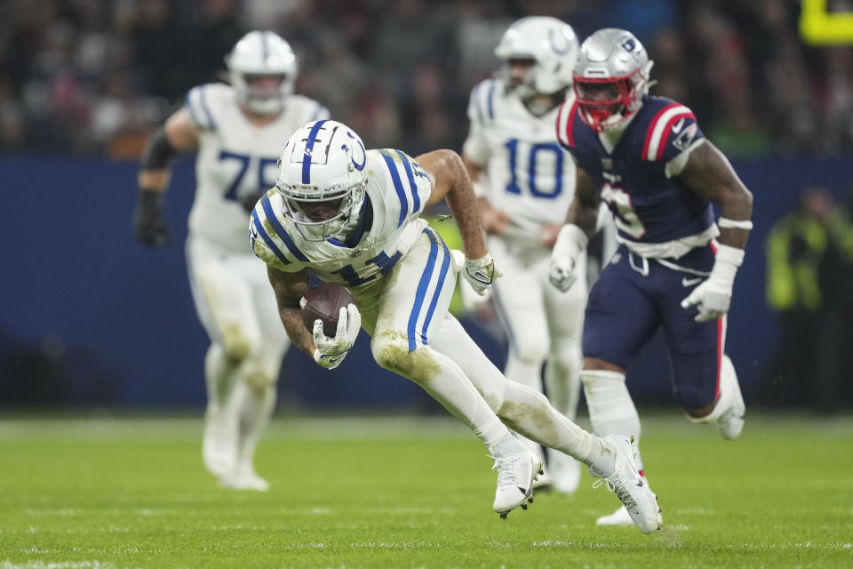 Indianapolis Colts wide receiver Michael Pittman Jr. (11) carries on a reception in the second half of an NFL football game against the New England Patriots in Frankfurt, Germany Sunday, Nov. 12, 2023. (AP Photo/Michael Probst)