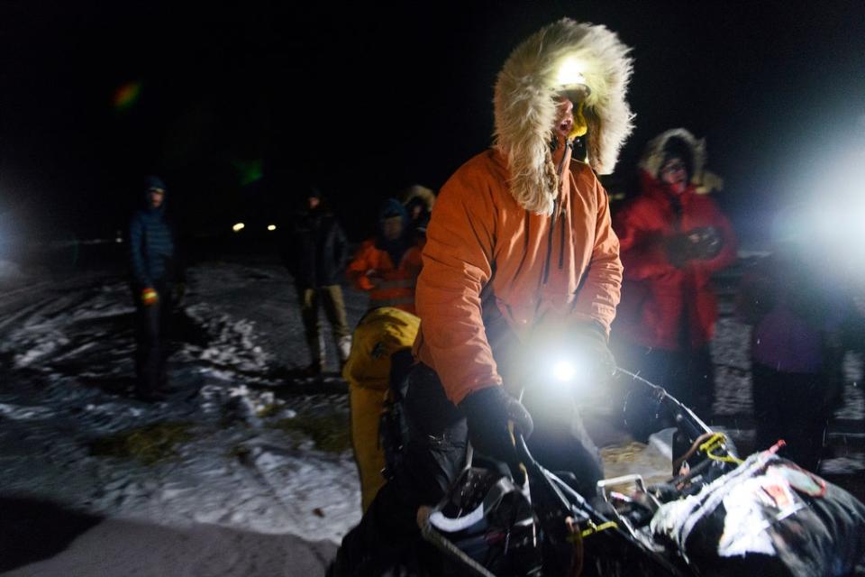 Musher Brent Sass calls for his team to go as he departs the Iditarod Trail Sled Dog Race in Unalakleet, Alaska on Saturday, March 12, 2022 (Anchorage Daily News)