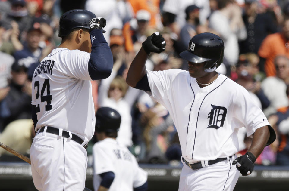 Detroit Tigers' Torii Hunter, right, is congratulated by teammate Miguel Cabrera on his solo home run off Baltimore Orioles starting pitcher Chris Tillman during the fourth inning of a baseball game in Detroit, Sunday, April 6, 2014. (AP Photo/Carlos Osorio)