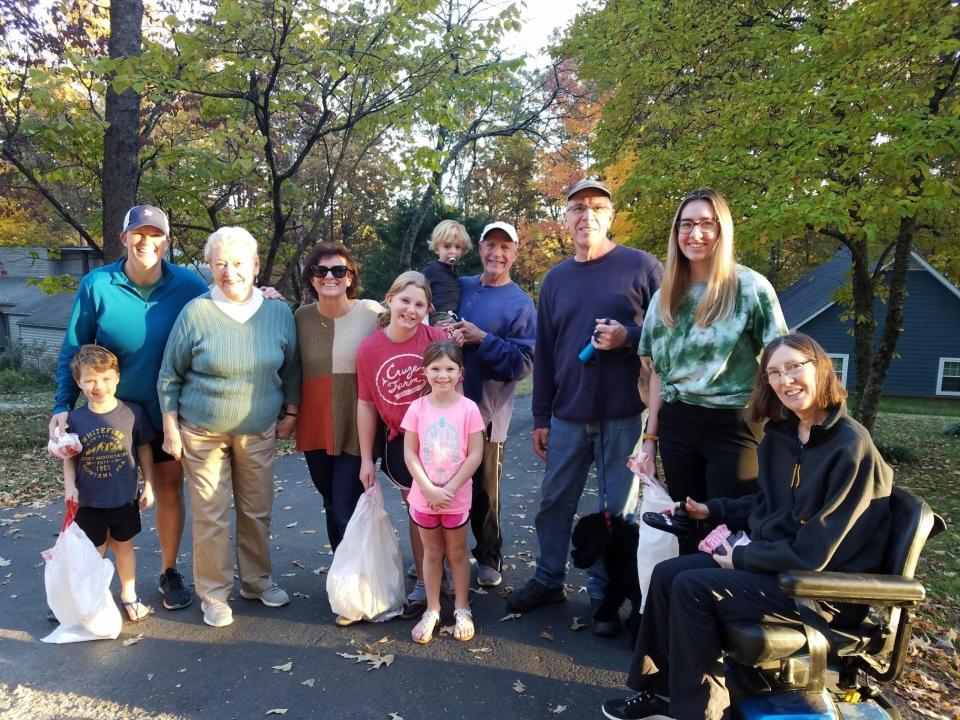 Ridgerock community volunteers pause for a picture during their trash pickup on Nov. 10, 2021, in memory of John Stewart and in honor of Nancy Stewart. 
From left: A.J. Lowe, Julia Lowe, Nancy Stewart, Barbara Fields, Ellie Lowe, Lucy Lowe (in front), Preston Fields (holding Owen Wall), John Labine, Claire Labine and Lisa Labine.