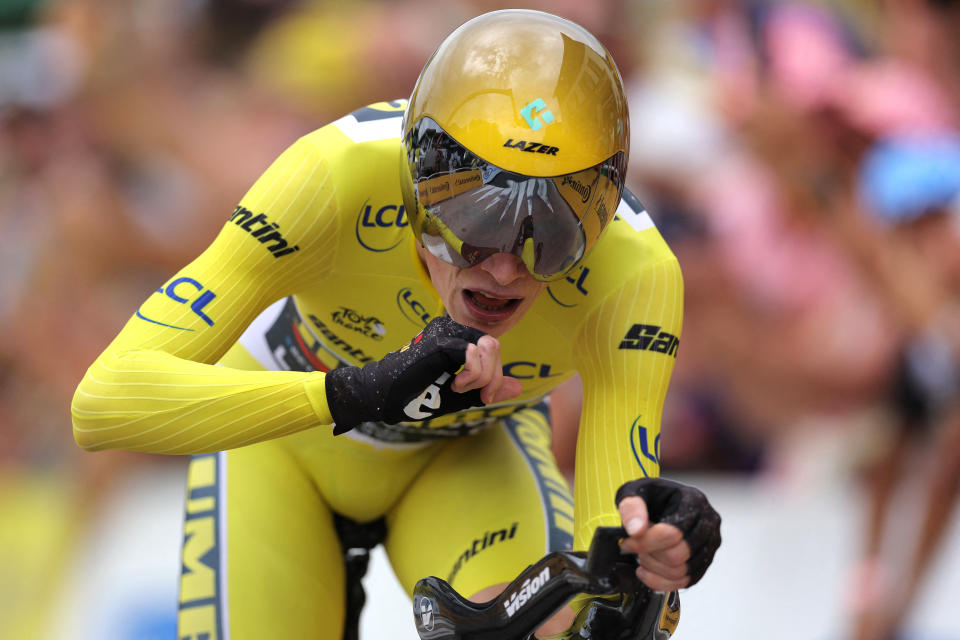 Jumbo-Visma's Danish rider Jonas Vingegaard wearing the overall leader's yellow jersey cycles to the finish line during the 16th stage of the 110th edition of the Tour de France cycling race, 22 km individual time trial between Passy and Combloux, in the French Alps, on July 18, 2023. (Photo by Thomas SAMSON / AFP)