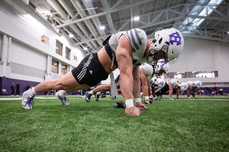 Holy Cross' Jordan Fuller works out during football spring practice Tuesday.