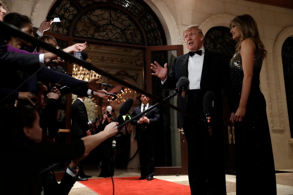 President Donald Trump speaks to reporters on Tuesday night at his Mar-a-Lago resort in Florida.