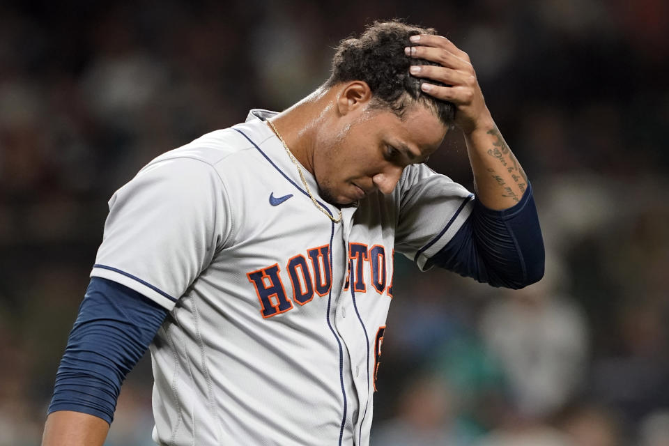 Houston Astros pitcher Bryan Abreu walks off the field after being pulled during the sixth inning of a baseball game against the Seattle Mariners, Monday, July 26, 2021, in Seattle. (AP Photo/Ted S. Warren)