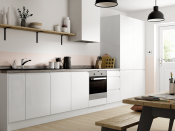 <p>Simple and streamlined, white handleless cabinets are a must for the ultra minimalists. With a neutral palette of black and white, mixed with natural woods, and a small collection of Scandi accessories. </p><p>Pictured: <a href="https://www.benchmarxkitchens.co.uk/kitchens/madison-gloss-white-" rel="nofollow noopener" target="_blank" data-ylk="slk:Madison gloss white at Benchmarx;elm:context_link;itc:0;sec:content-canvas" class="link ">Madison gloss white at Benchmarx</a></p>