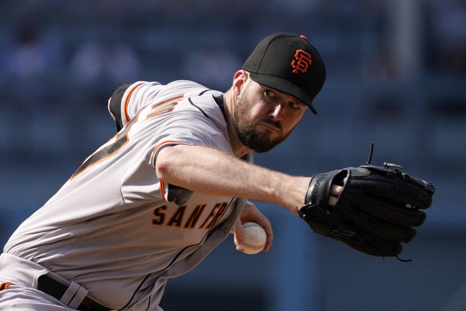 San Francisco Giants starting pitcher Alex Wood throws to the plate during the first inning of a baseball game against the Los Angeles Dodgers Saturday, July 23, 2022, in Los Angeles. (AP Photo/Mark J. Terrill)