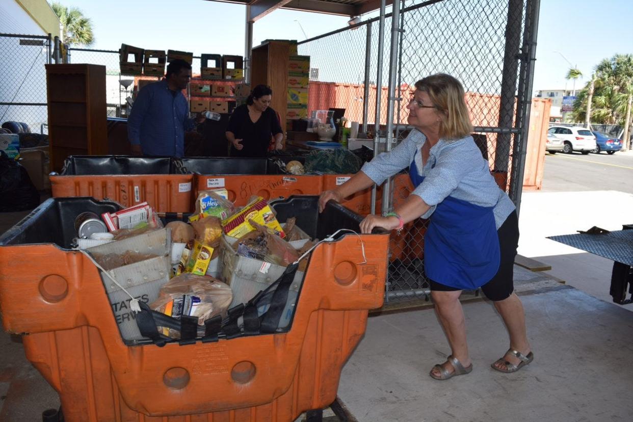 BEAM volunteers take in donations collected during the Stamp Out Hunger food drive, organized by the National Association of Letter Carriers. This year's event returns on May 14 after a two-year hiatus.