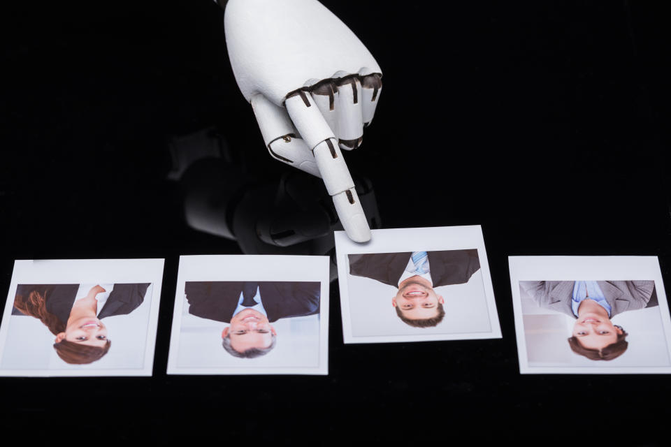 Close-up Of A Robot's Hand Selecting Candidate Photograph